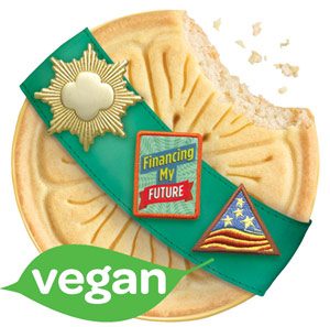 Lemonade cookie shortbread with a lemon design printed on top with a girl scout sash over the top of the cookie