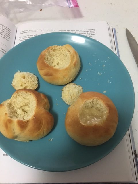 Buns with the tops hollowed out and the centers exposed