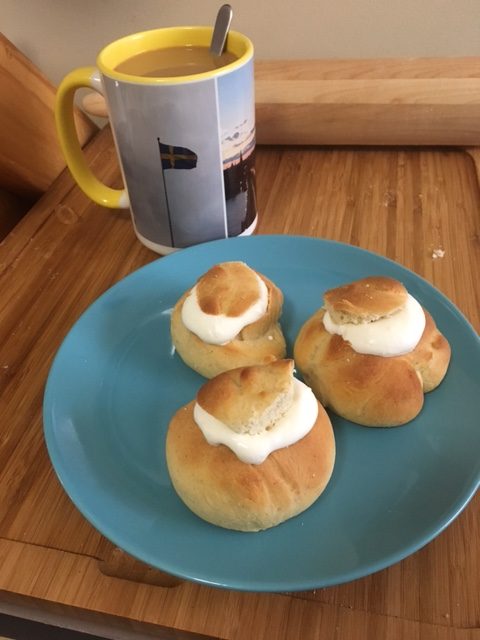 Cream filled pastries with a mug of coffee 