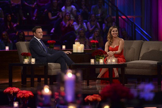 Liz and Chris Harrison talk on stage.