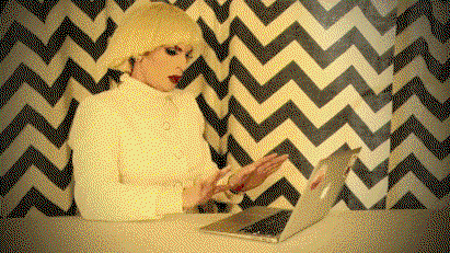 A gif of a laptop being slowly pushed away