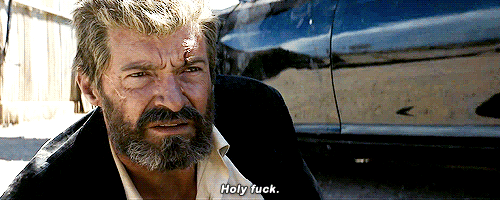 Logan beside a car saying Holy Fuck