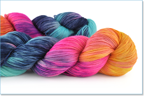 A skein of yarn in pink, orange, purple and teal.