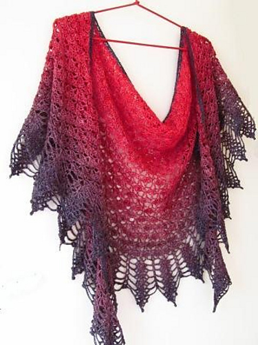 A lacey crescent shaped shawl.