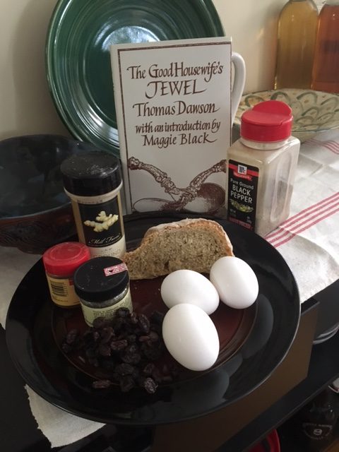 Ingredients picture! Eggs, raisins, thyme, cloves, ginger, bread, and pepper, along with the copy of The Good Housewife's Jewel I borrowed.