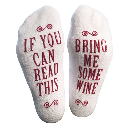 Socks with grippy text on the bottoms that say If You Can Read This Bring Me Some Wine 