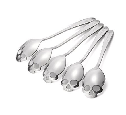 Steel spoons with skulls for bowls and little eyes and nose holes at the edge 