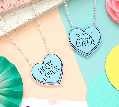 Book Lover silverplate necklaces with Book Lover printed on a blue heart hanging from a silver chain 