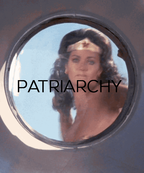 wonder woman smashes a window labelled (patriarchy)