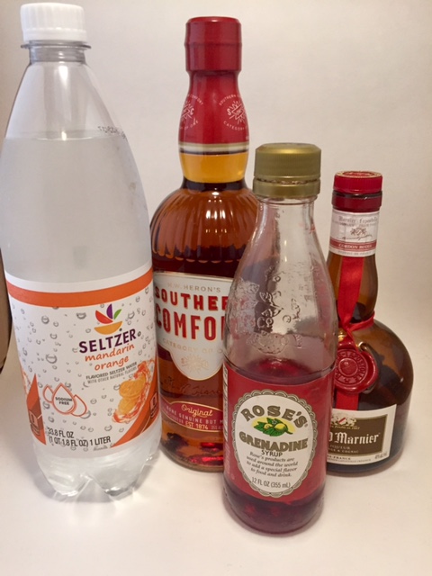 Ingredients for an Into the Sunset - seltzer in orange flavor, southern comfort grenadine and grand marnier