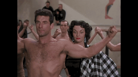 Dorthy is agog at a man flexing his biceps.