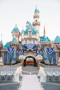 chairs lined up for Disneyland wedding in front of castle