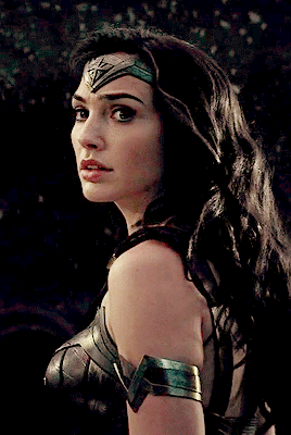 Wonder Woman looks over her shoulder poignantly
