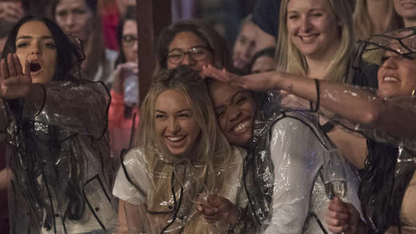 Corinne, Rachel, Raven and Alexis laugh hysterically as the men wrestle in cat food mud