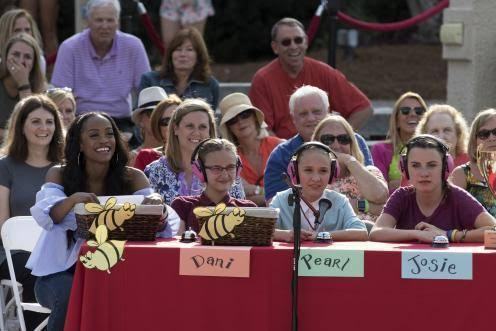 Three 12 year old girls help Rachel judge the spelling bee.