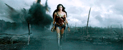 Diana, in her full Wonder Woman guise, striding across no mans land. It's a big deal, and she is very serious.