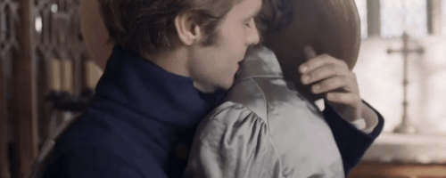 His hand hovers over her back for a few seconds before he tenderly touches her. It's perfect.