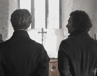 Ross and Enys turning at Caro's entrance. Enys gets a huge smile on his face.