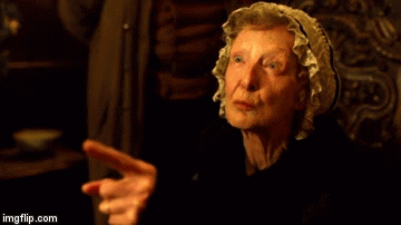 Aggie, using the horned hand gesture to curse George.