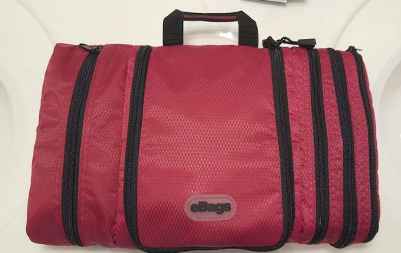 My bag, in raspberry, zipped up and sitting on my sink