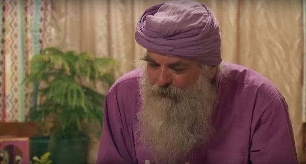 Dean's dad, Paramroop looks off camera.