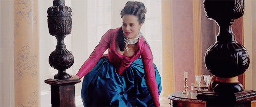 A gif of a gorgeous dress with a hot pink jacket and royal blu skirt