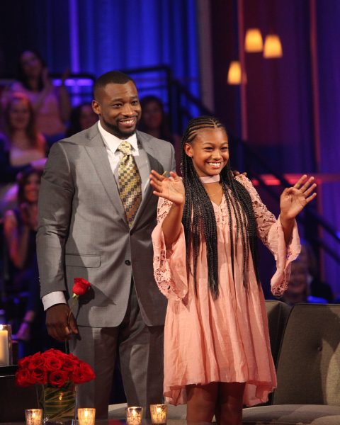 Kenny stands next to Mackenzi.