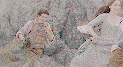 Drake, running after a grinning Morwenna. He's got a handful of seaweed in his hand