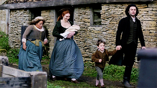 From left to right: Prudie, Demelza holding Clowance, Jeremey holding Ross's hand, walking to the church for Clowance's baptism.