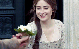 Morwenna takes a posy of primroses from Drake