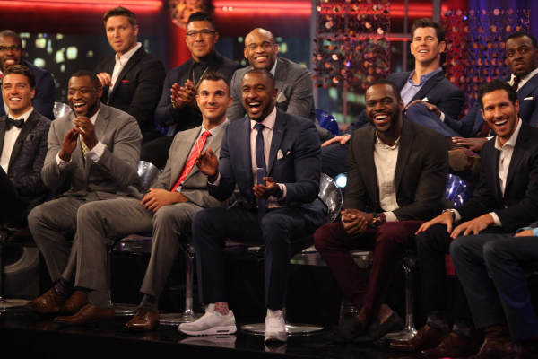 A group shot of the dudes on stage