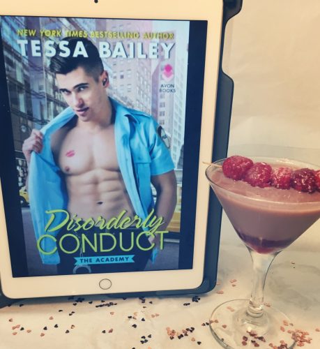 A chocolate raspberry martini next to a digital copy of Disorderly Conduct