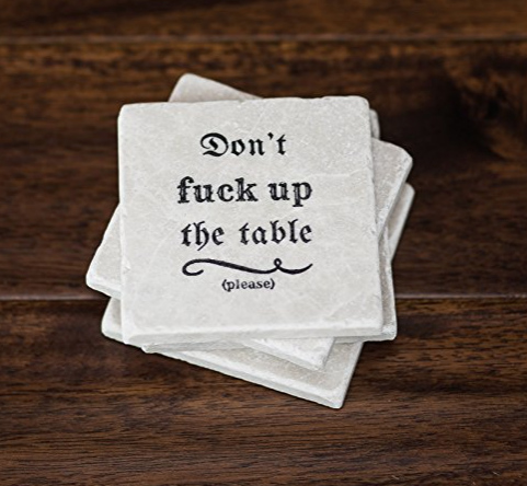 Stone coasters that say Don't Fuck Up the Table