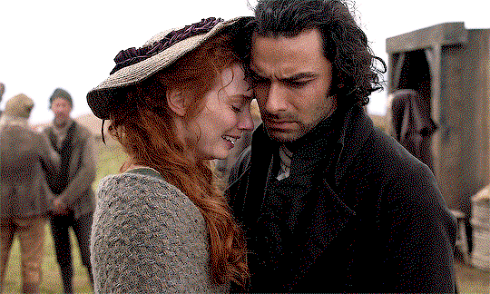 Demelza, toching her forehead to Ross' cheek as she cries. Ross just looks terribly broken.