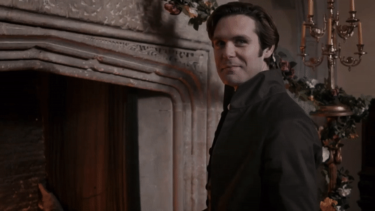 Enys looking at Caro with the human depiction of heart eyes