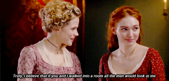 Caro and D, standing together. Caro saying, Truly, I believe that if you and I walked into a room, all the men would look at me...