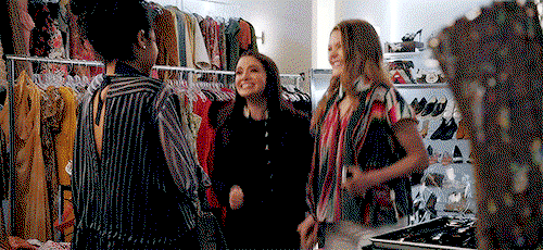 Kat, Jane, and Sutton in the Closet, jumping up and down and laughing
