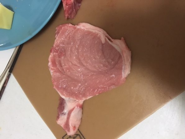 A pork chop that's had the bone cut off, and been pounded with a can of condensed milk. You can see the rings from the can left in the meat.