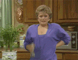 Blanche from The Golden Girls spritzs herself down with a water bottle.