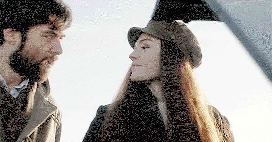 Bree and Roger, flirting over a car engine.
