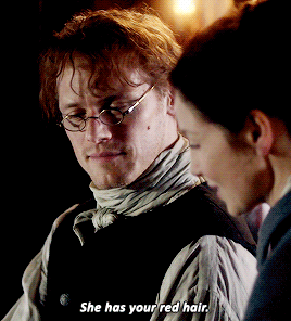 Jamie and Claire, looking through the pictures of Brianna, and Jamie, wearing his glasses (it's super hot), while Claire explains to him that Brianna has his red hair.