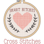 An embroidery hoop that has Smart Bitches and a big heart with cross stitches written beneath the hoop
