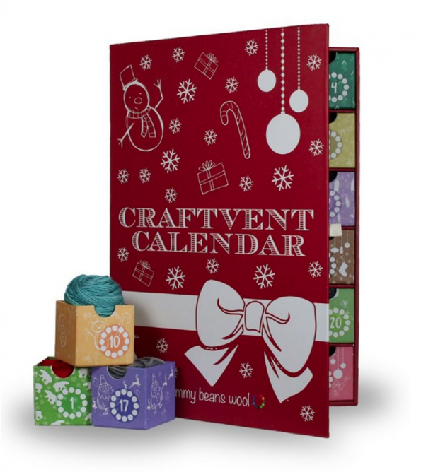 Red Jimmy Beans wool box with tiny drawers, each with a small skein of wool inside it.