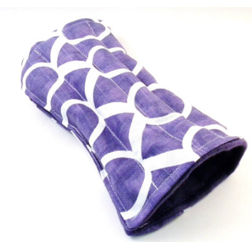 Purple wrist wrap filled with rice and flax for warming in the microwave