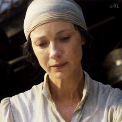 Claire putting the rabbits foot in Elias' hand before he is buried at sea. It needs to be done by a friend.