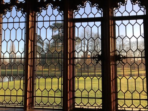 View from window shows moat and trees