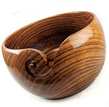 Shiny sheesham wood knitting yarn bowl with a curved cutout for the yarn