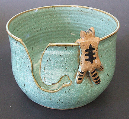 Yarn Bowl with tabby cat hanging off the edge