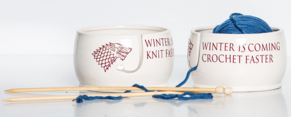 Ceramic bowl with a wolf head logo from Game of Thrones and either Winter is Coming Knit Faster, or Winter is Coming Crochet Faster