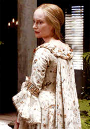 Geillis, in her gorgeous patterened sacque-back gown, looking disgusted.